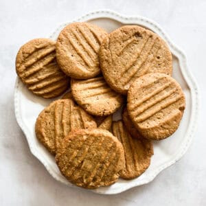 Gluten-free peanut butter cookies on a white plate.