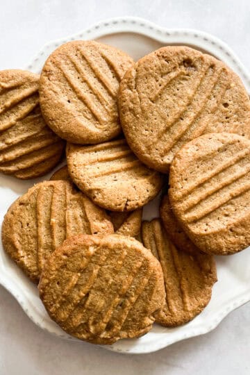 Gluten-free peanut butter cookies on a white plate.