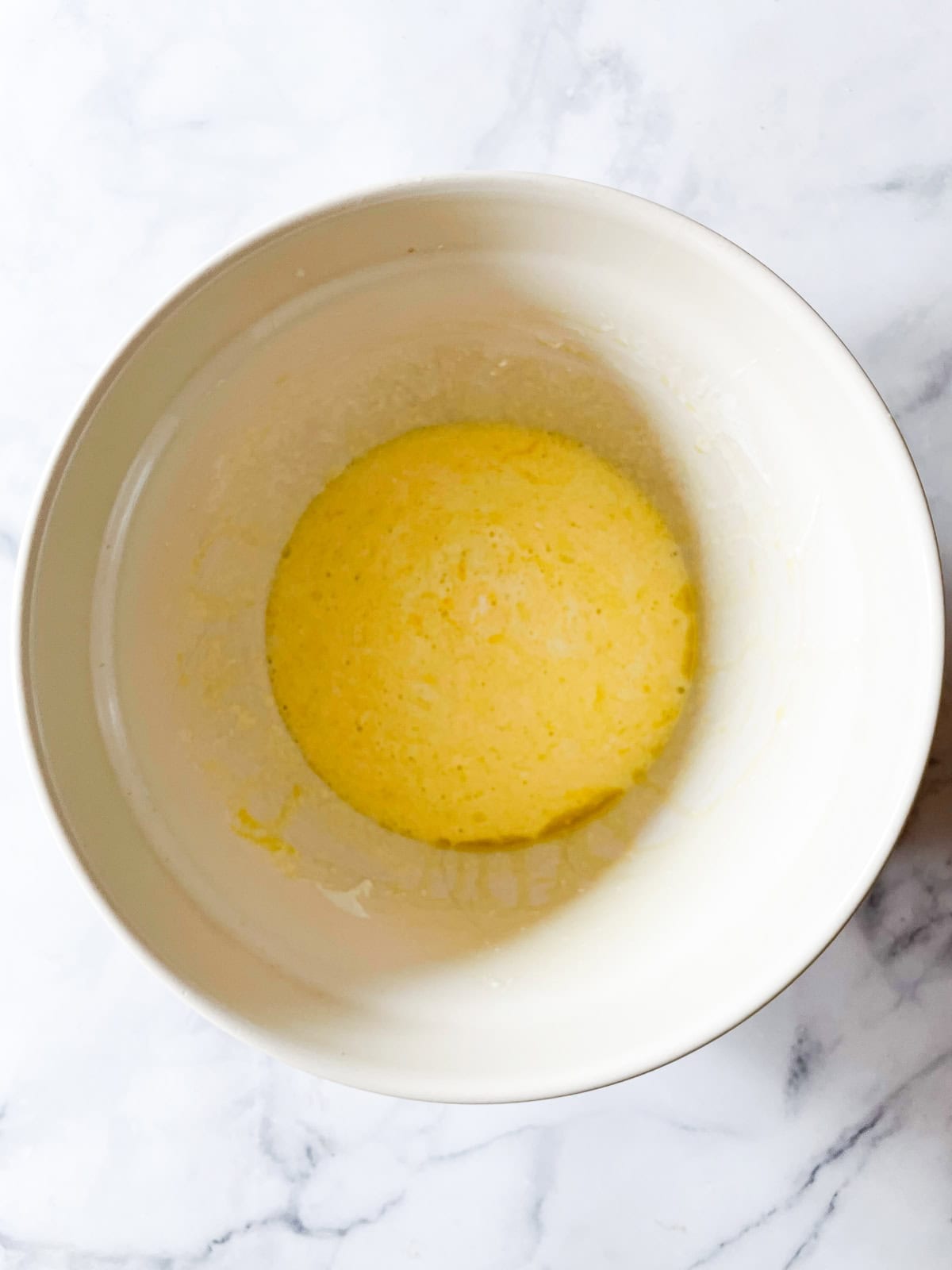 Eggs are mixed in a bowl.