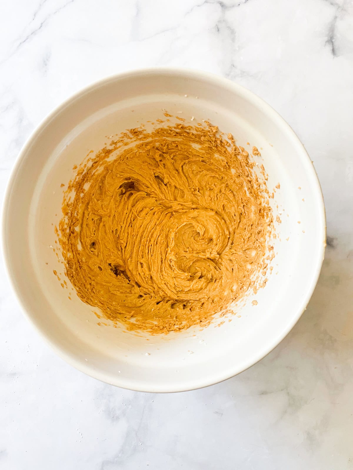 Peanut butter and butter creamed in a bowl.