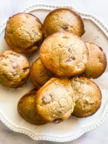 A plate of gluten free strawberry rhubarb muffins.