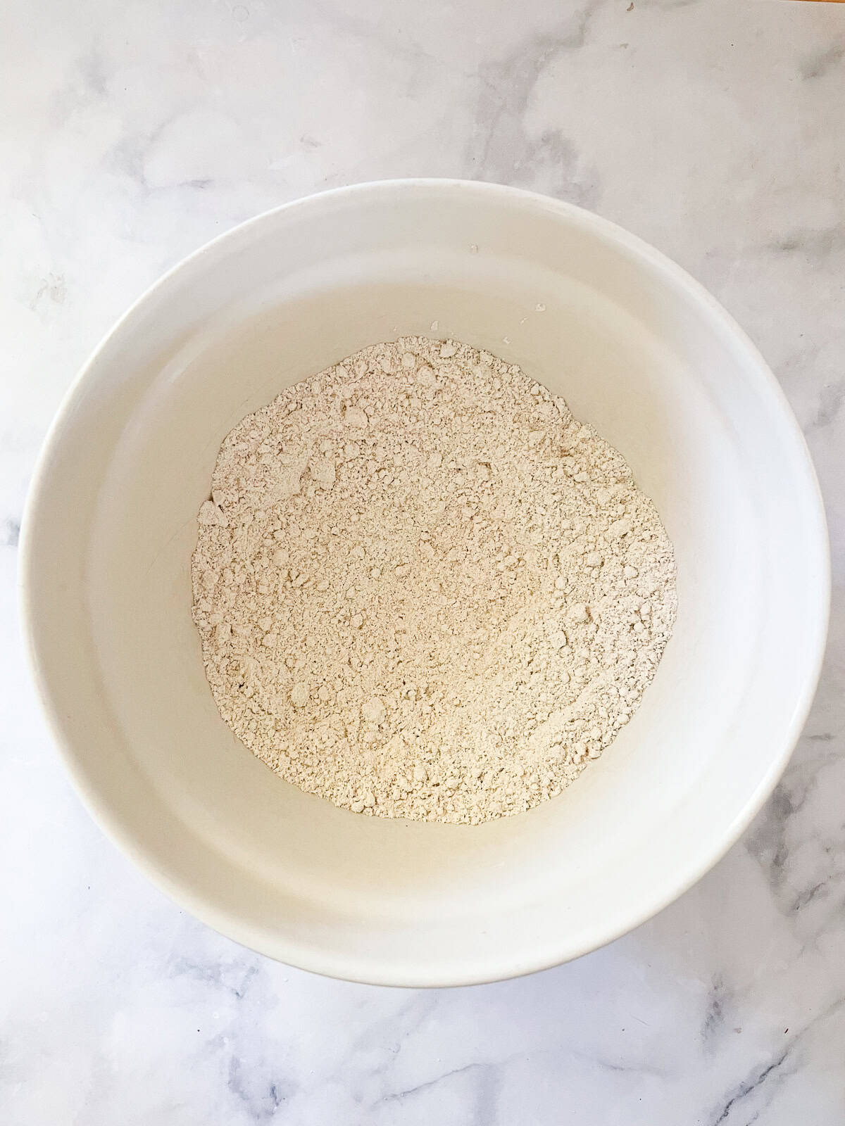 The dry ingredients for vegan strawberry muffins in a bowl.