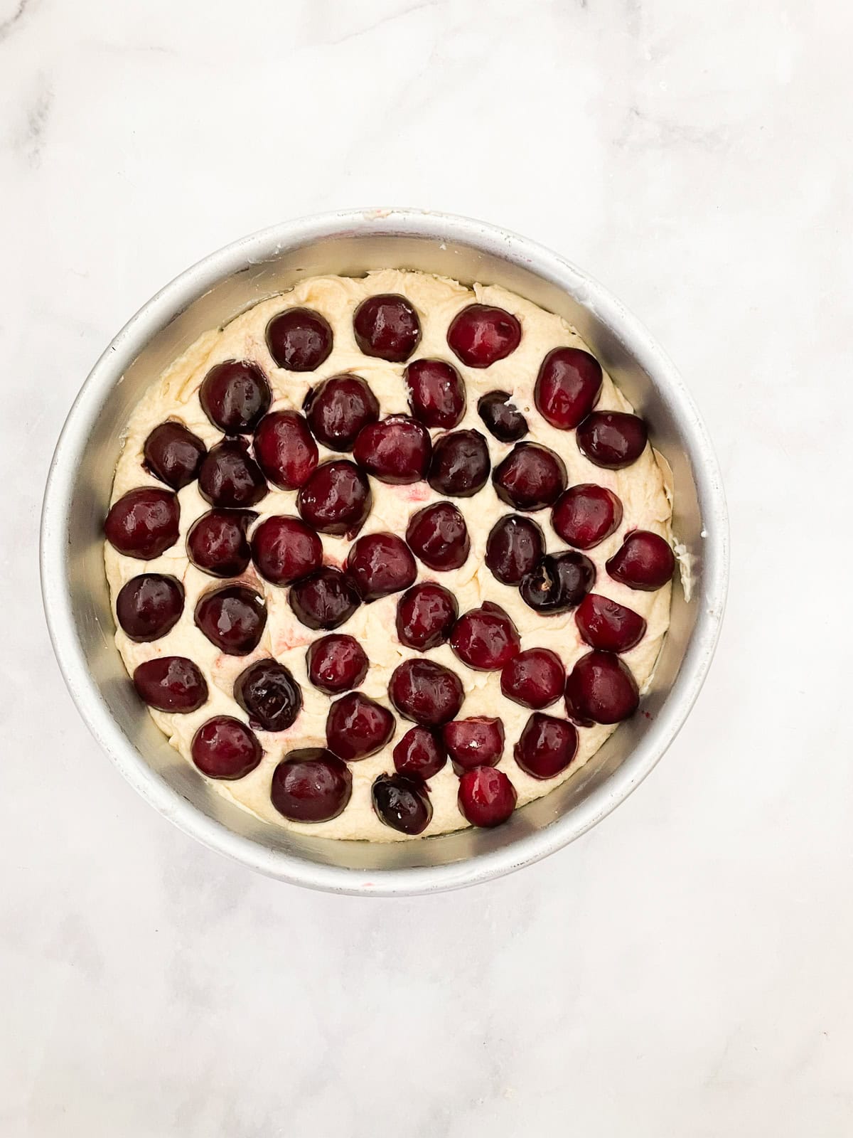 This rustic gluten-free cherry torte tucks sweet, fresh cherries into a tender, buttery cake made with just two simple gluten-free flours. Cherries are added to the top of cake batter.