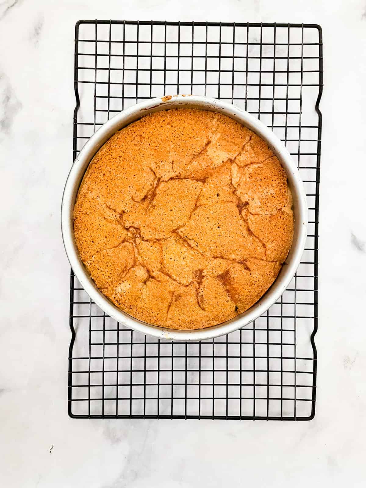 This rustic gluten-free cherry torte tucks sweet, fresh cherries into a tender, buttery cake made with just two simple gluten-free flours. A gluten free cherry torte cools in the pan after baking.
