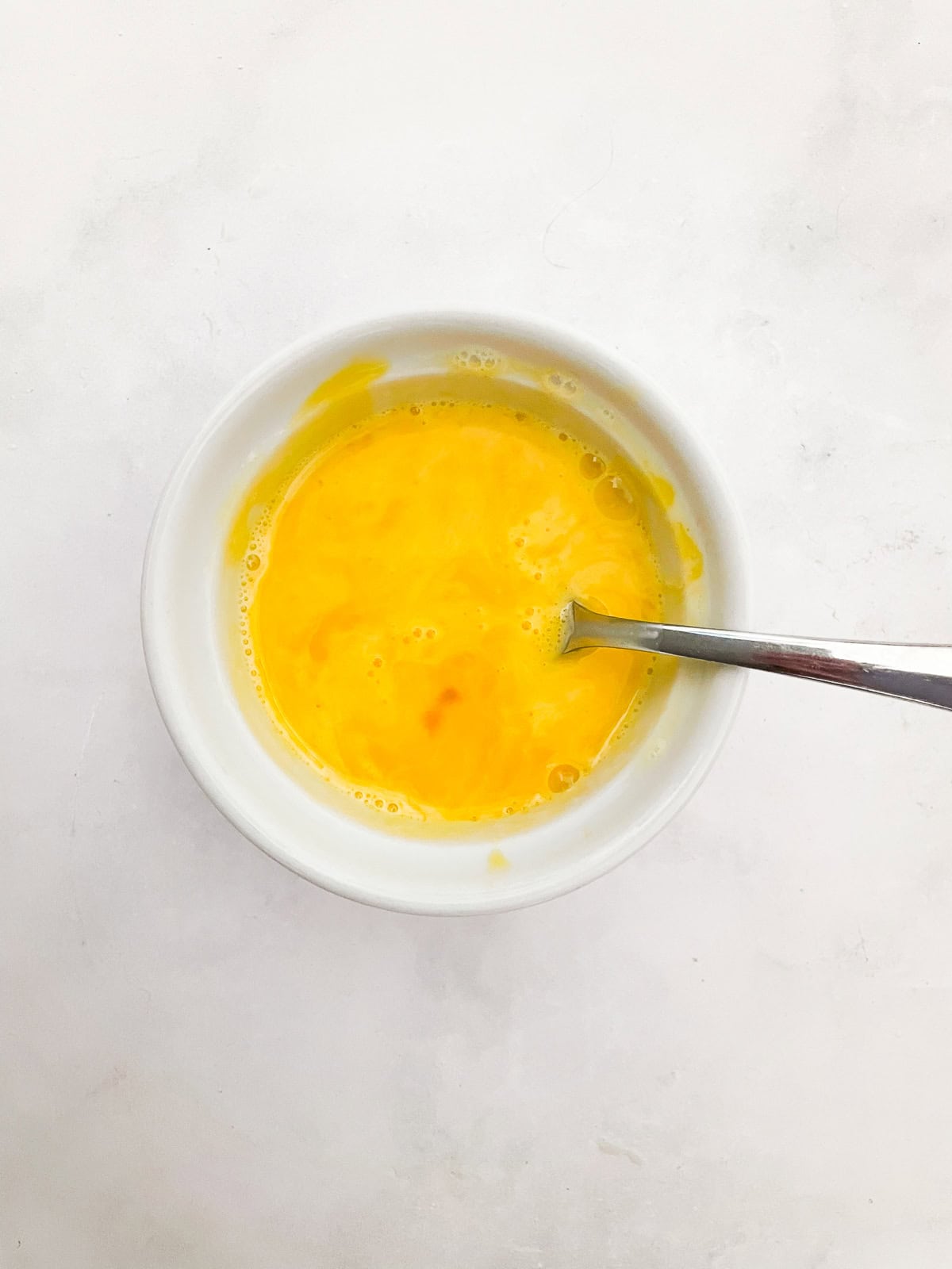 Silky smooth and wonderfully rich gluten free chocolate pudding comes together easily to make a celebration-worthy dessert. Tempered egg yolks in a bowl.