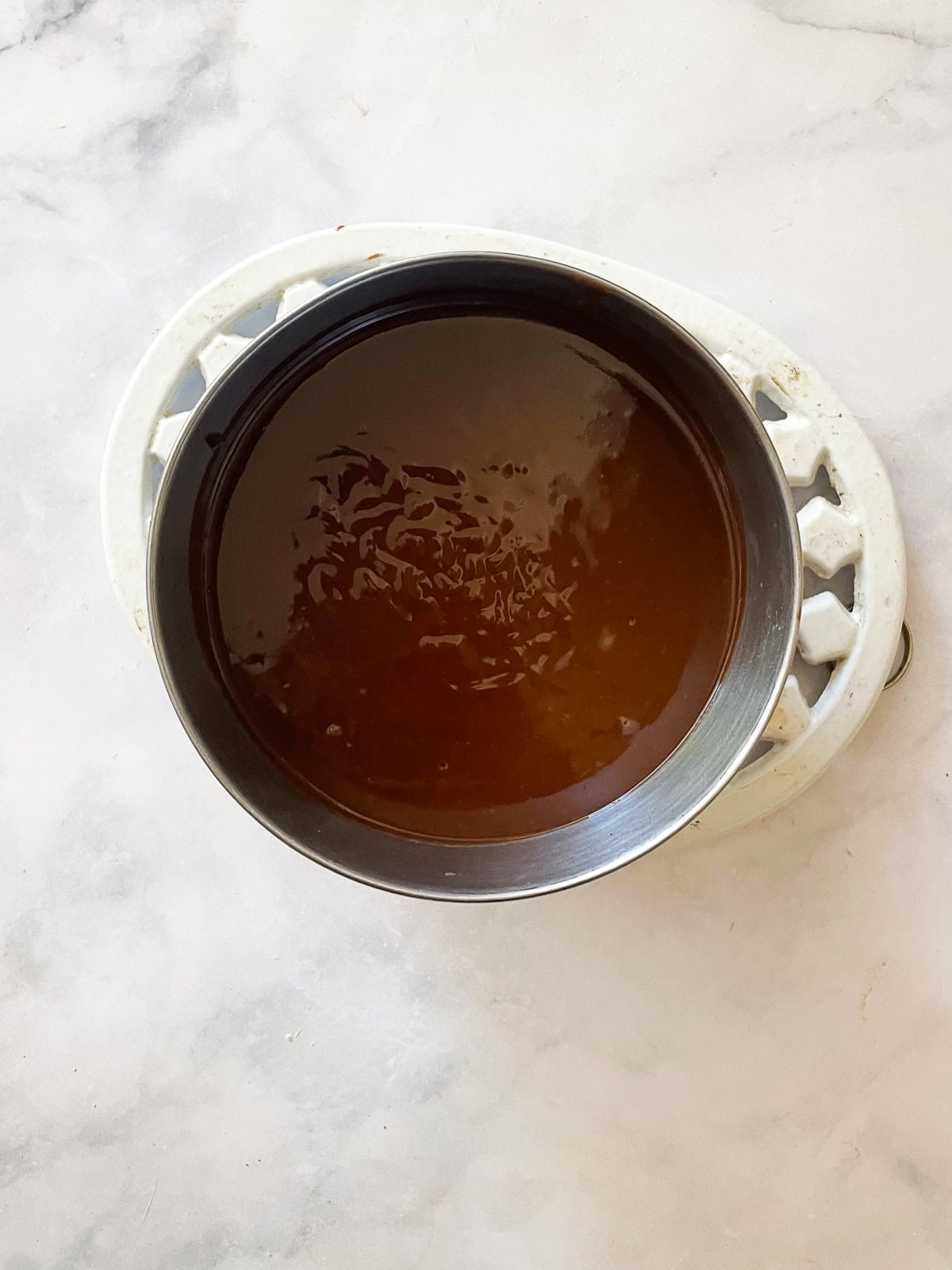 Silky smooth and wonderfully rich gluten free chocolate pudding comes together easily to make a celebration-worthy dessert. A strained bowl of chocolate pudding.