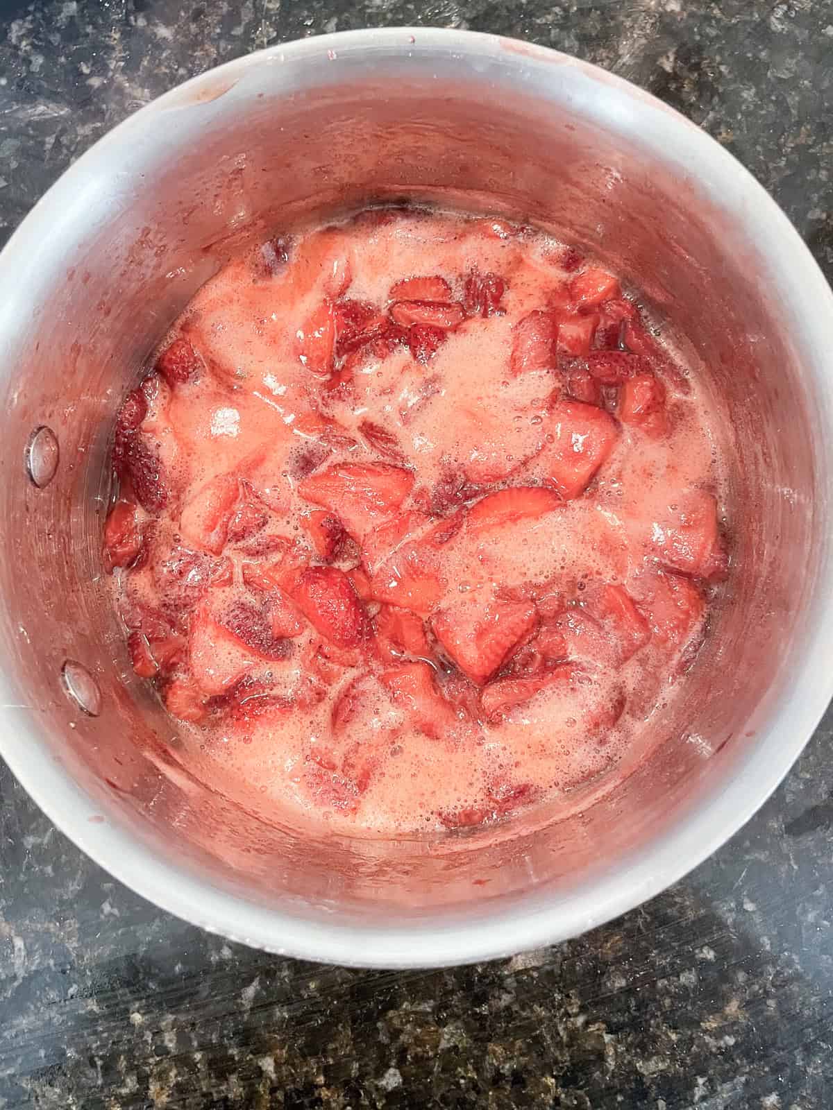 A recipe for a beautifully hued, low sugar strawberry jam that's also made without pectin. You can make this a refrigerator jam or can it. Strawberry jam boils in a pot.