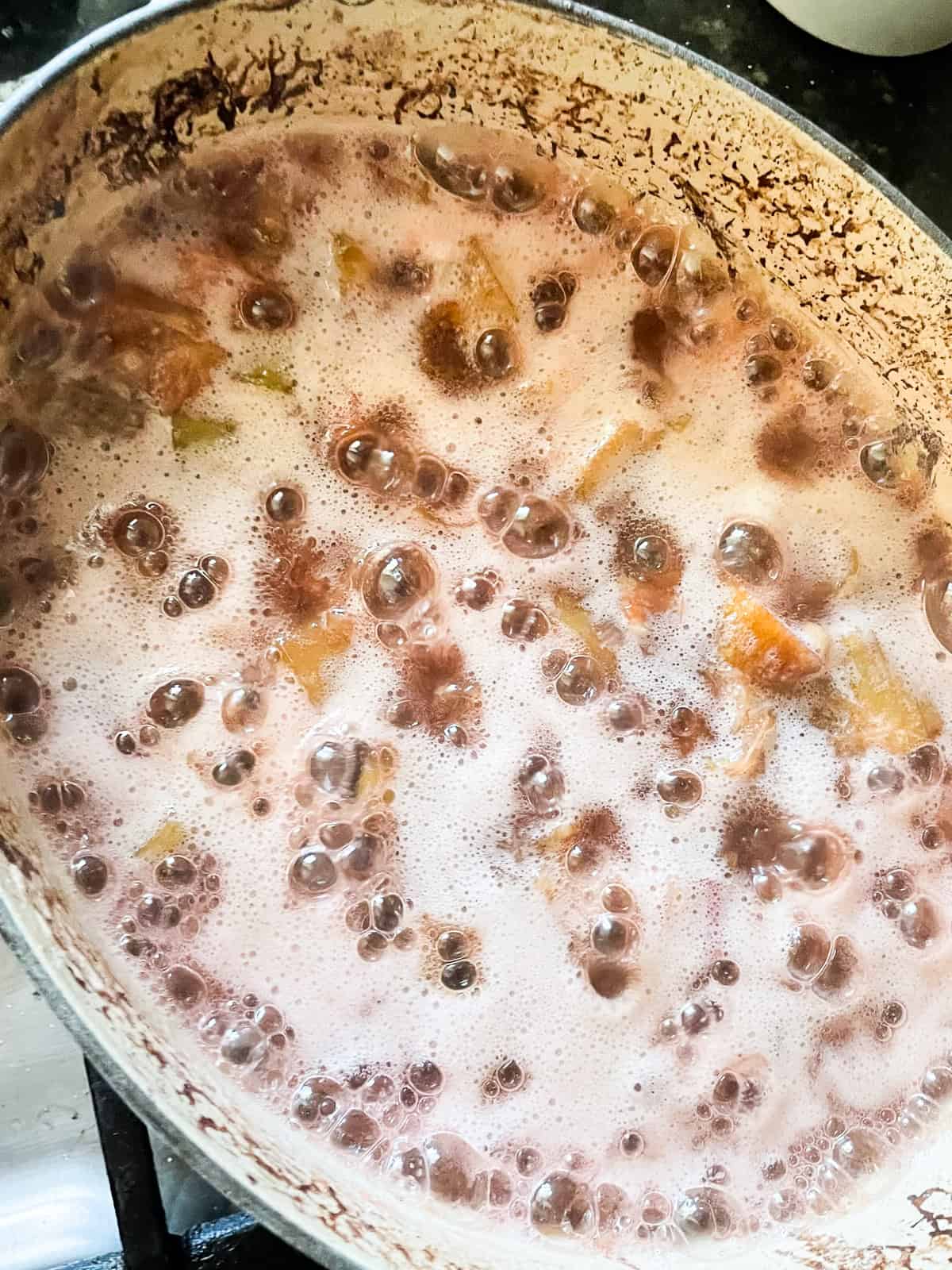 Strawberry rhubarb jam boils.