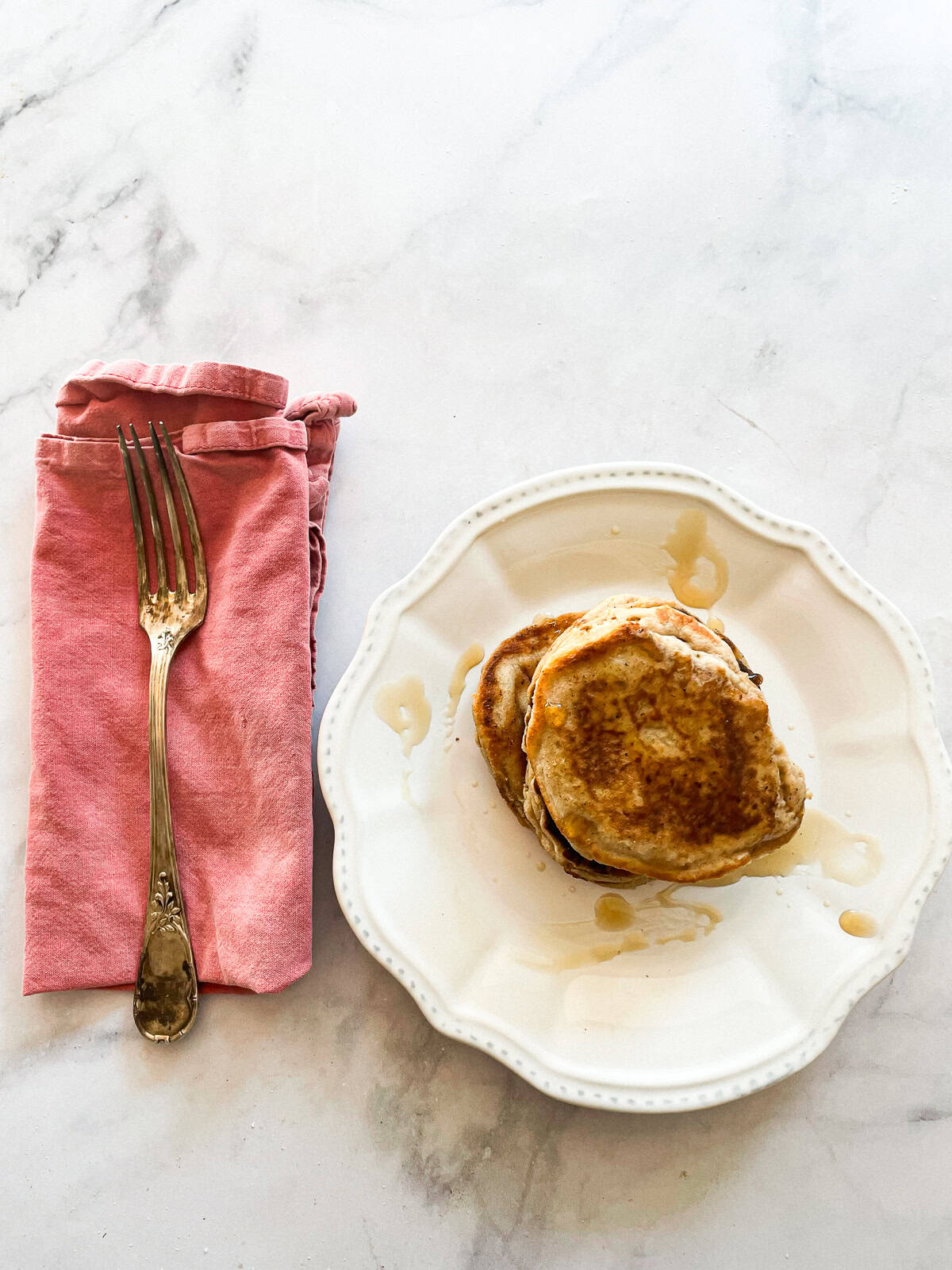 Tender and fluffy oat flour pancakes are made with oat flour for a gorgeous, naturally gluten-free breakfast option. A one-bowl recipe! Oat flour pancakes on a plate with maple syrup.