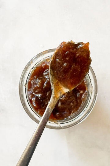 Raspberry rhubarb jam on a spoon.