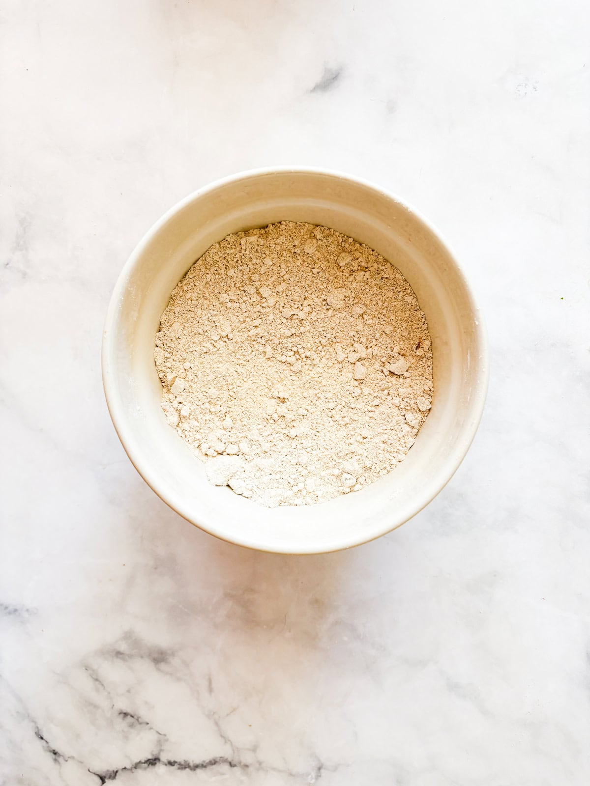 Sweetly simple gluten free banana & zucchini bread is made with whole grain flour and summer's zucchini, plus walnuts for crunch.