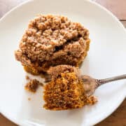 A bite of pumpkin coffee cake on a fork.