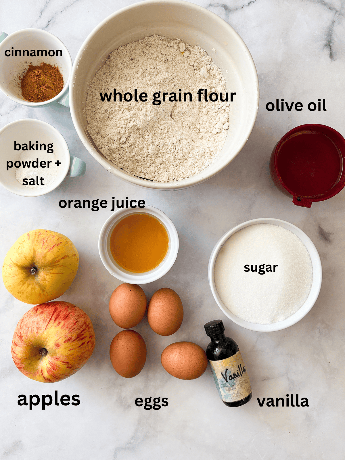 This homey gluten free one bowl apple cake is packed with whole-grain flour and juicy bites of cinnamon-spiked apples. Also dairy-free! ingredients for whole grain one bowl apple cake are text labeled.