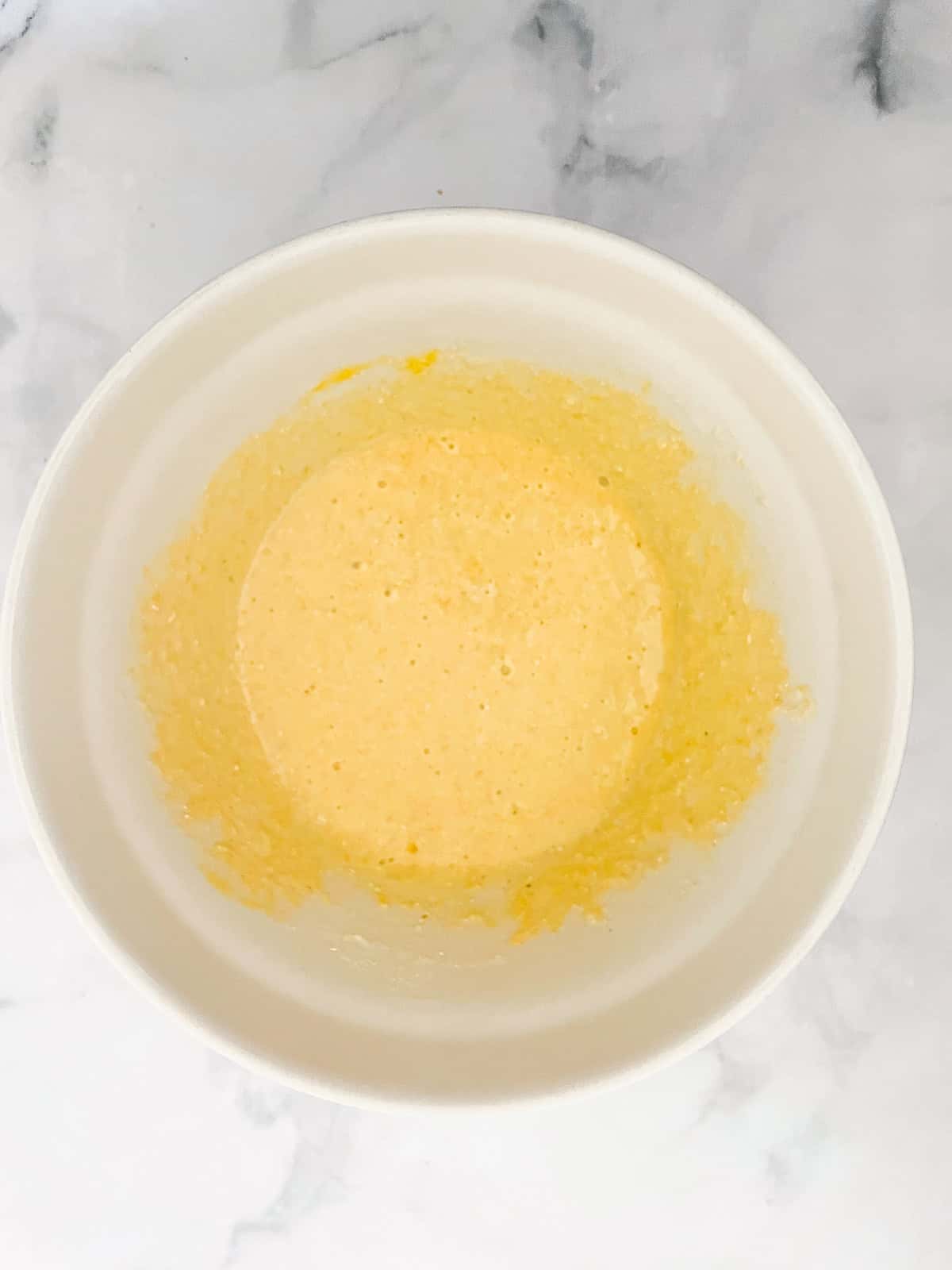 Easy, gluten-free almond flour cornbread is made with a combo of almond flour and cornmeal. Wonderful with soups, stews, chili, and more. Almond flour cornbread batter in a bowl.