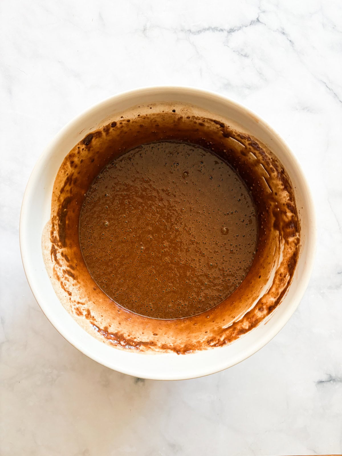 This is the best chocolate cake: Moist, tender, and with a perfect gluten-free crumb! Top it with chocolate buttercream for a real treat. Best chocolate cake batter in a big bowl.