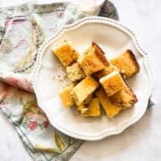 A plate of almond flour cornbread squares on a napkin.