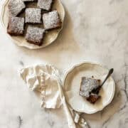 Slices of gluten free applesauce cake on plates.