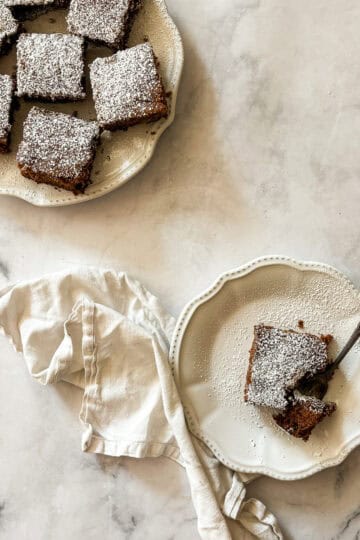 Slices of gluten free applesauce cake on plates.