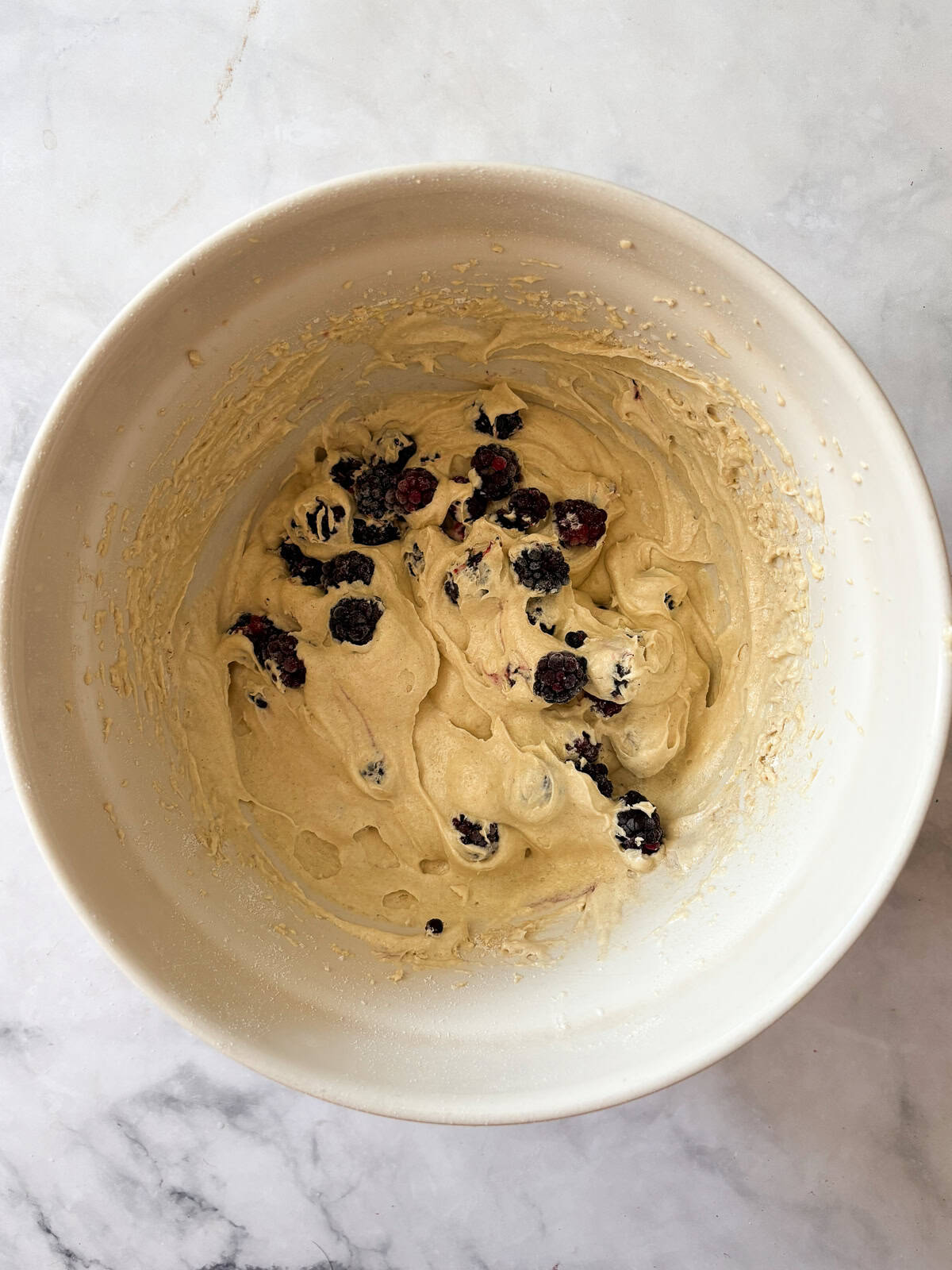 This gluten free blackberry cake features a plush vanilla cake swirled with juicy berries! Delicious and beautiful. Blackberries are added to cake batter.