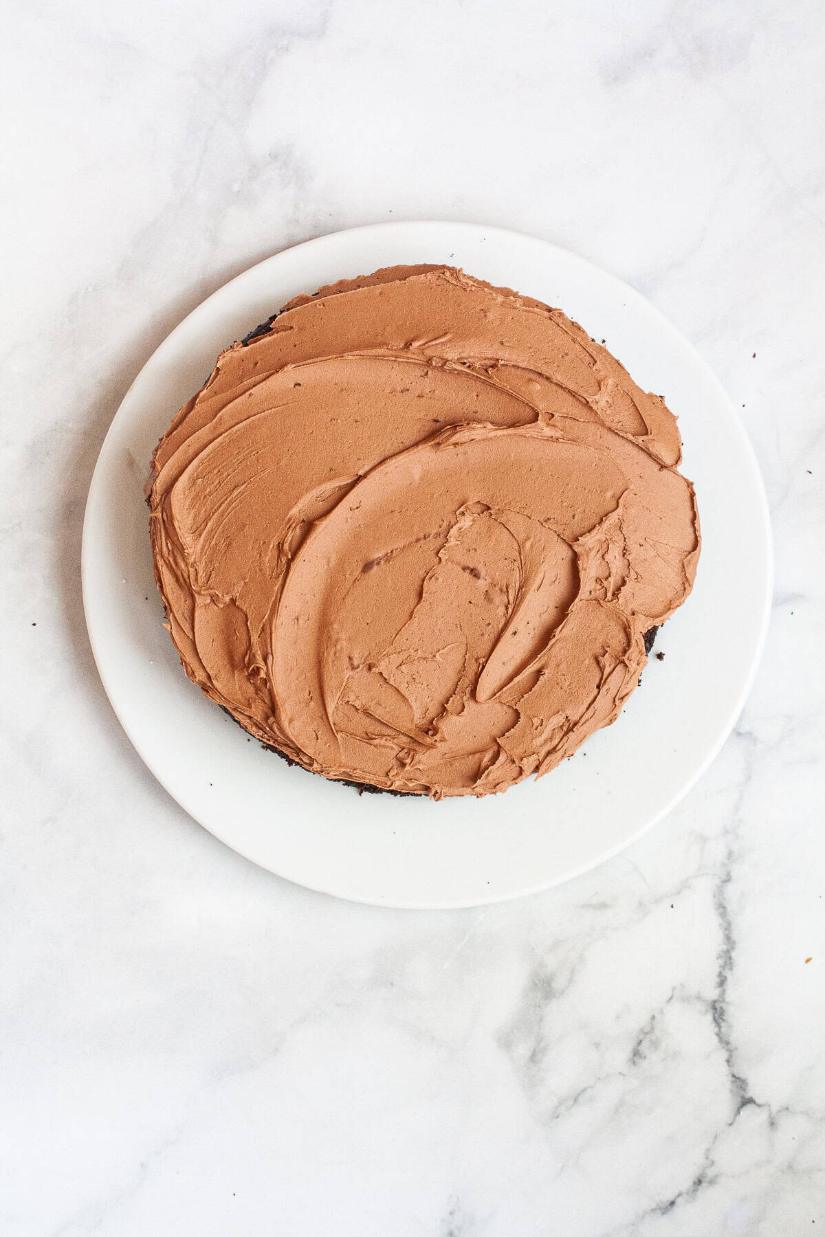 This gluten-free chocolate cake is a deeply dark chocolate cake with a soft and tender crumb that's perfect with fluffy chocolate buttercream. A gluten-free chocolate cake with chocolate frosting.