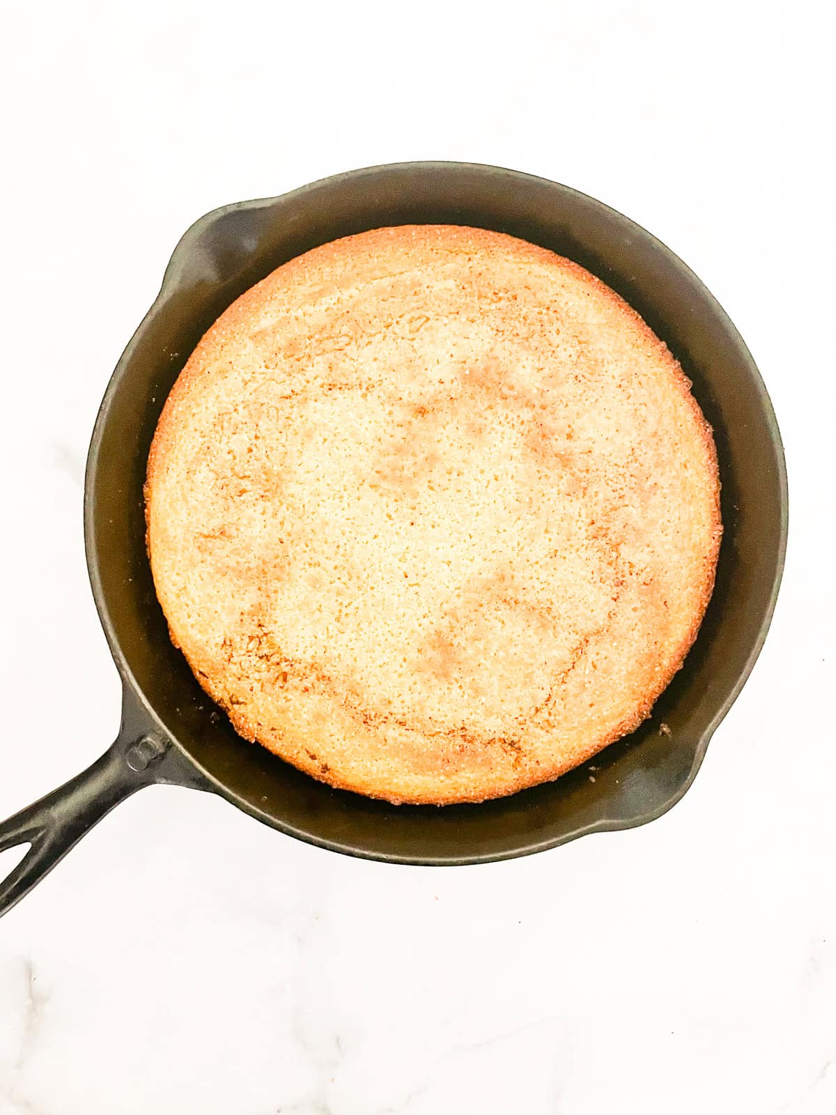 This gluten-free maple cornbread is tender-crumbed perfection thanks to buttermilk. Naturally sweetened with pure maple syrup! A pan of gluten free maple cornbread.