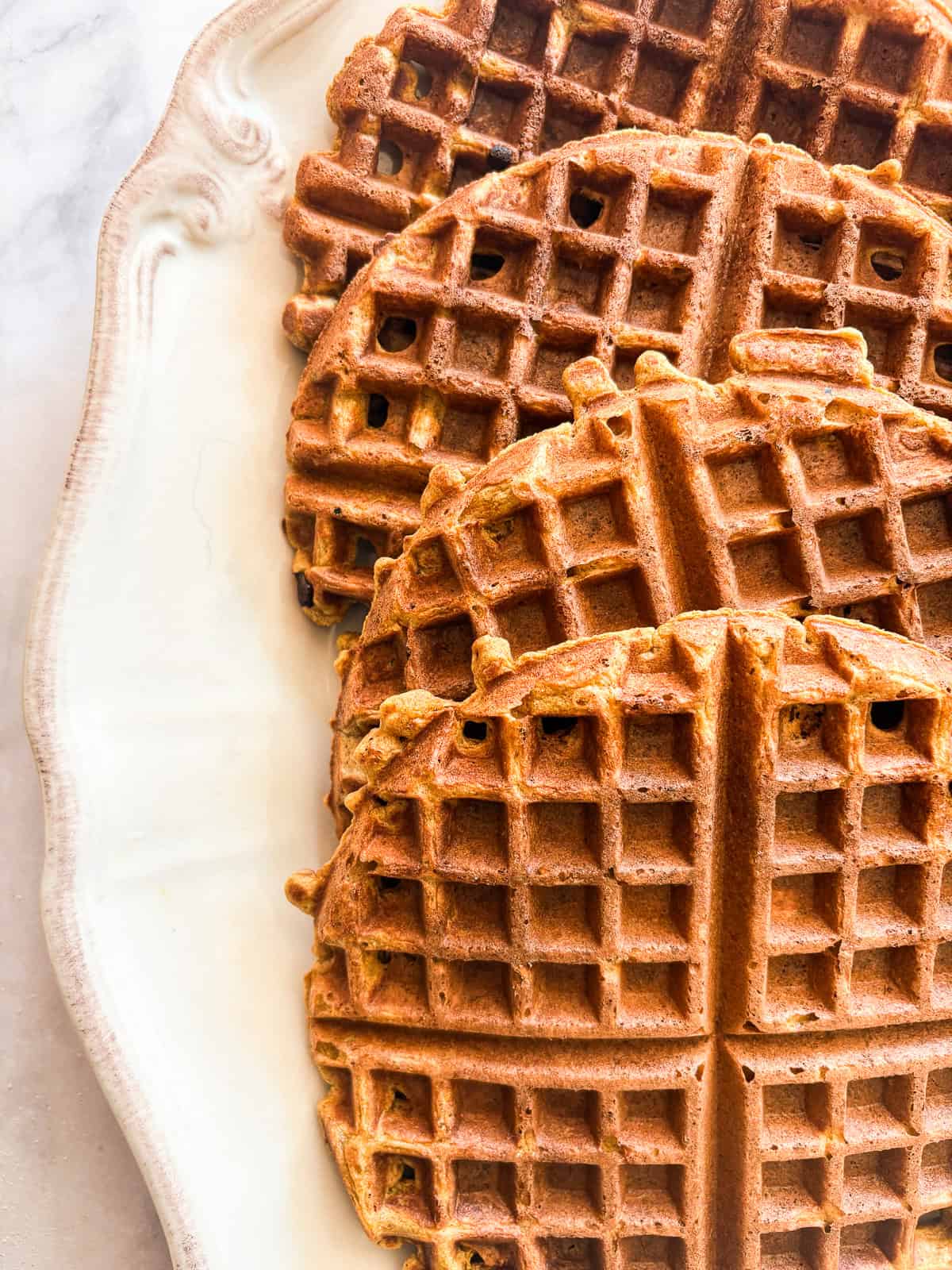 Pumpkin waffles on a dish.