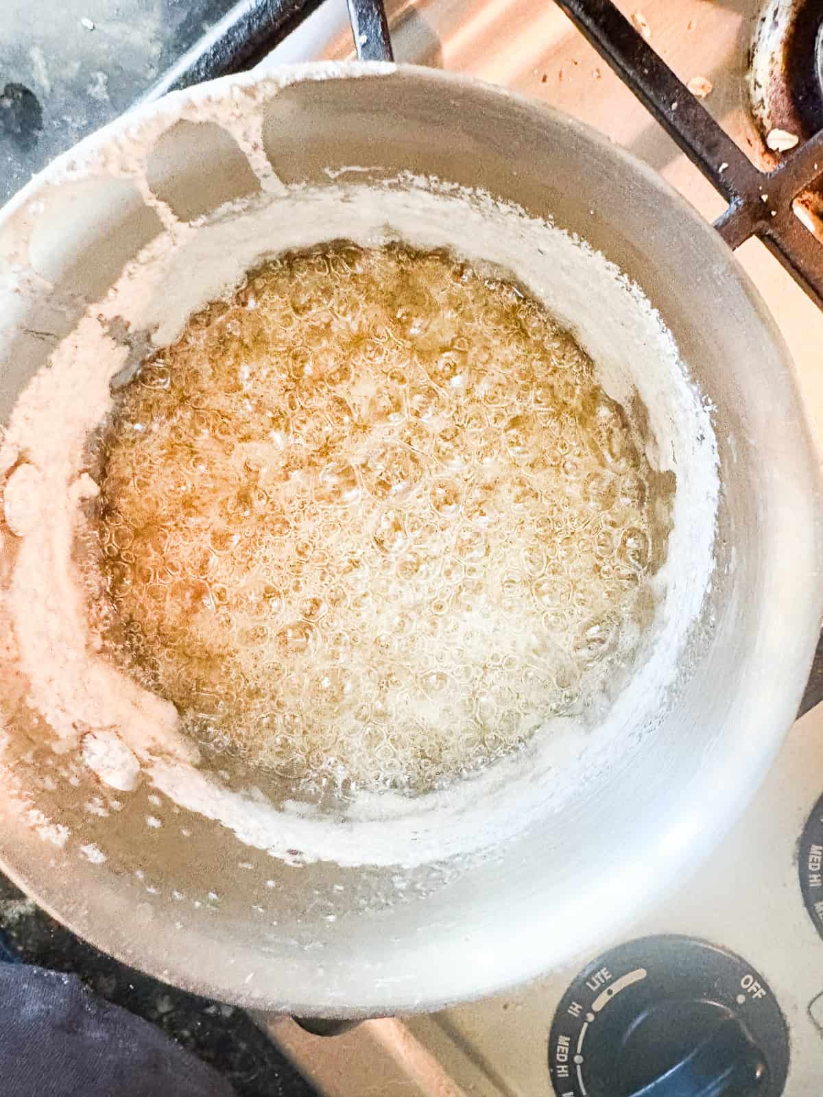 Silky and rich, this homemade salted caramel sauce is an absolute dream. Perfect over ice cream, waffles, cake, pancakes, and more. Bringing the mixture to a boil.