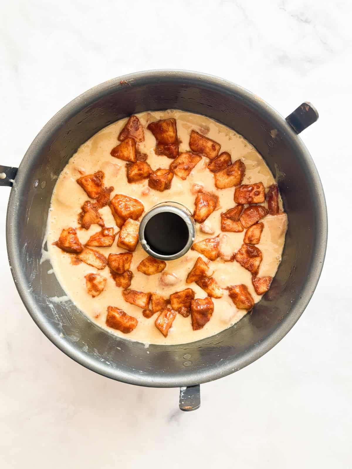 This homey gluten free one bowl apple cake is packed with whole-grain flour and juicy bites of cinnamon-spiked apples. Also dairy-free! Apples are added to the top of cake batter.