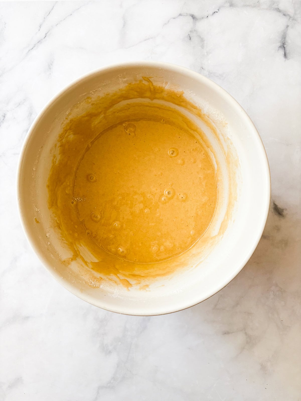 This homey gluten free one bowl apple cake is packed with whole-grain flour and juicy bites of cinnamon-spiked apples. Also dairy-free! A bowl of whole grain one bowl apple cake.