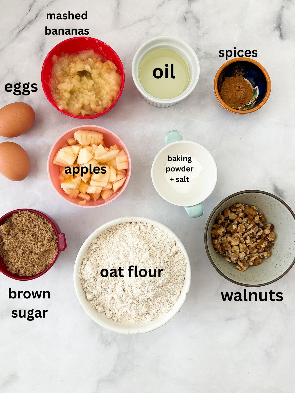 This beautifully simple yet deeply satisfying gluten free banana apple bread marries a classic banana bread with fresh for a twist. Ingredients for gluten free banana apple bread are text-labeled.