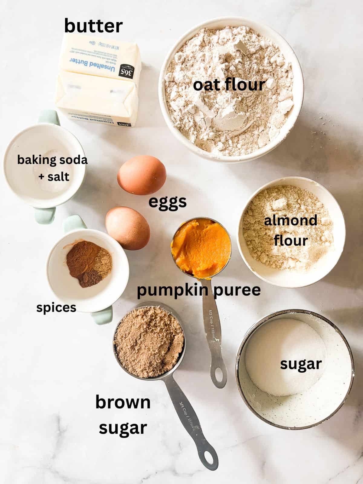 Gooey and soft browned butter pumpkin squares are easily gluten-free and delicious served warm with a scoop of ice cream. Ingredients for brown butter gluten free pumpkin squares are text-labeled.