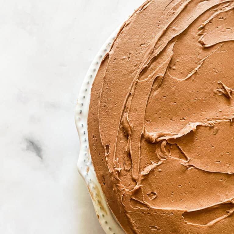 A cake frosted with chocolate buttercream frosting.