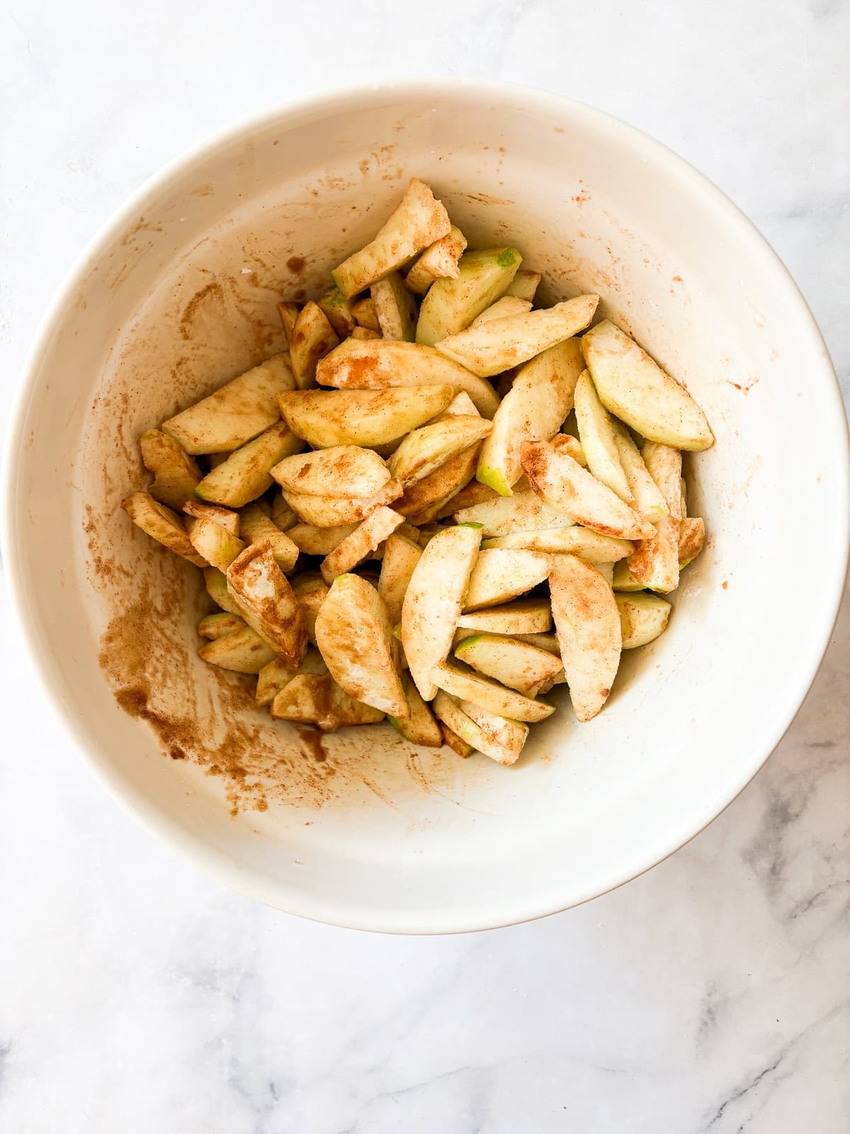 A crisp, buttery brown sugar streusel tops tender apples in this homey gluten free apple crumble. Perfect with vanilla ice cream! Apple slices are tossed with brown sugar and arrowroot for a gluten free apple crumble.