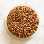 Chopped walnuts top a gluten free banana walnut cake.