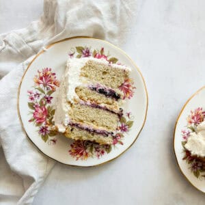 A slice of blackberry jam cake on plate.