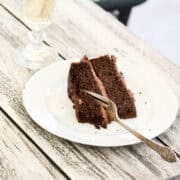 A fork cuts into a slice of gluten free pumpkin chocolate cake.