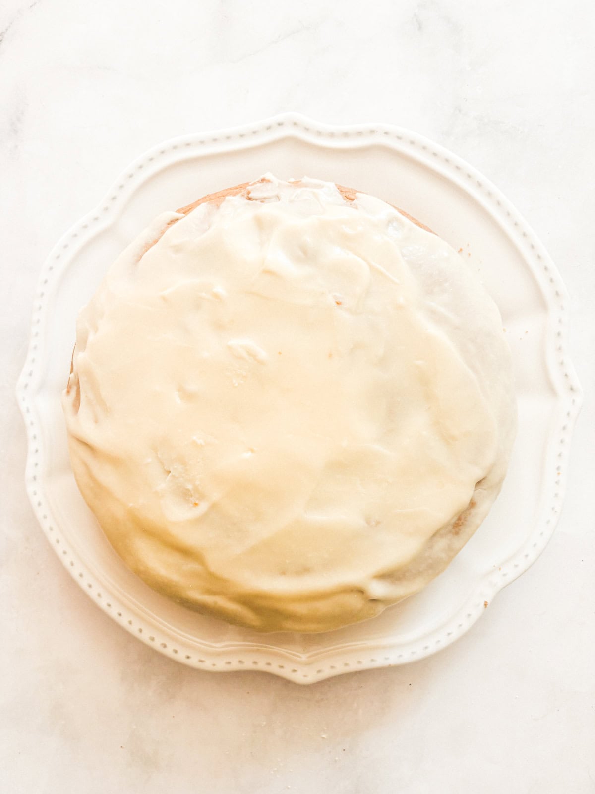 A thick maple glaze tops a soft gluten free pumpkin olive oil cake that's dairy-free, made in one bowl, and utterly delicious! A maple glaze tops a gluten free pumpkin olive oil cake.