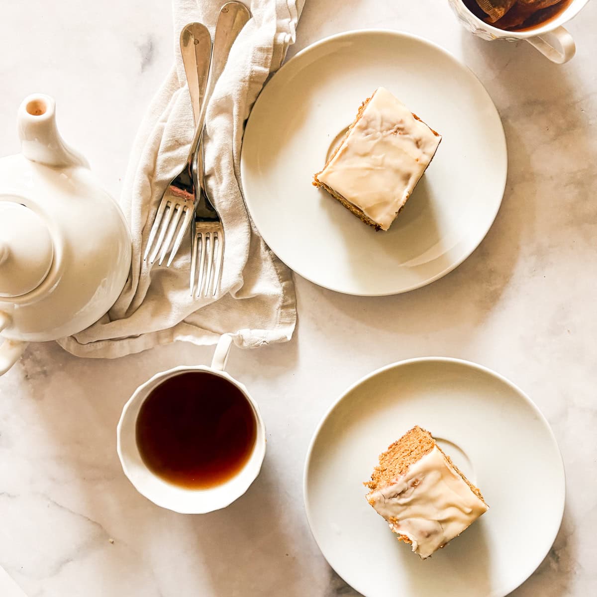 Slice of oat flour pumpkin cake and a cup of tea.