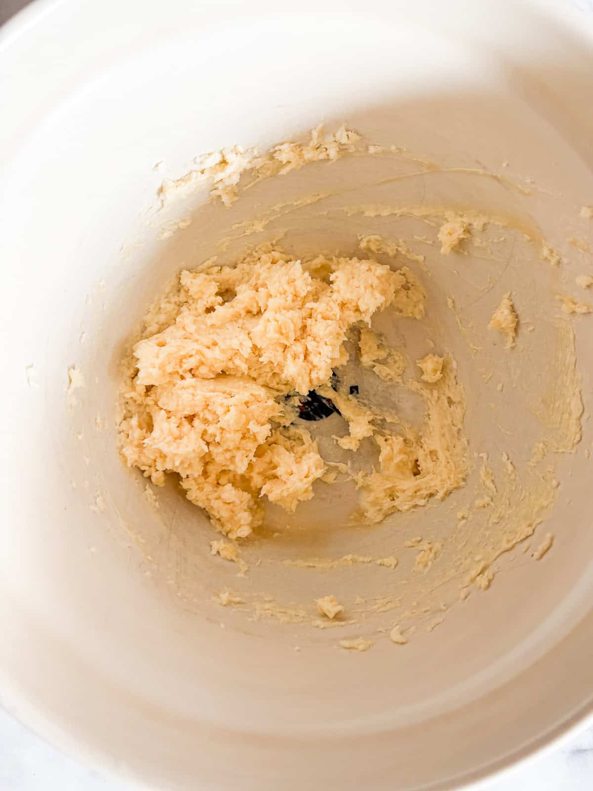 Salted caramel frosting is sweet-salty, creamy, and just fluffy enough. Perfect on everything, from cakes to cupcakes to brownies. Butter and salted caramel sauce combined in a bowl.