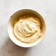 A small bowl of salted caramel frosting.