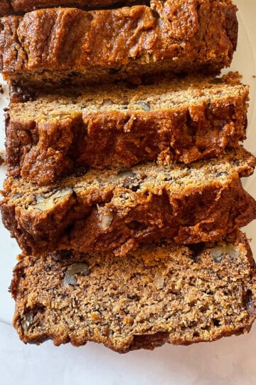 A sliced loaf of gluten free persimmon bread.
