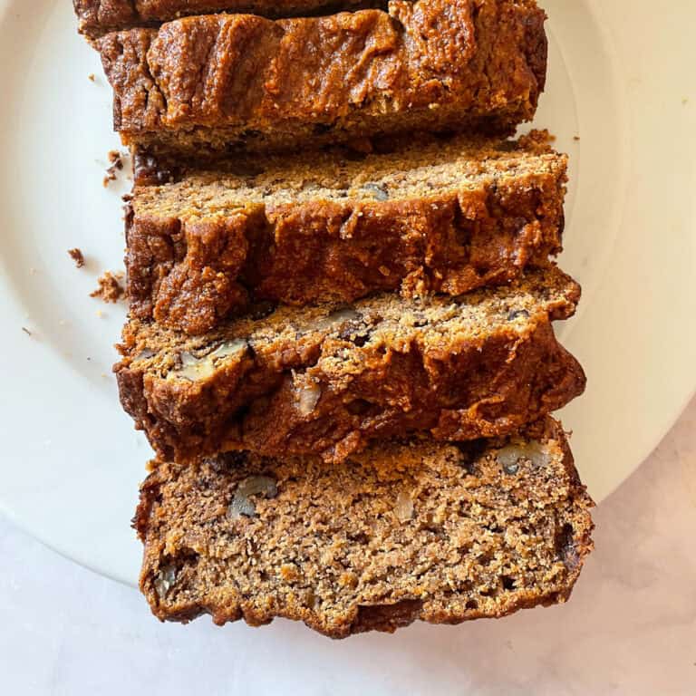 A sliced loaf of gluten free persimmon bread.