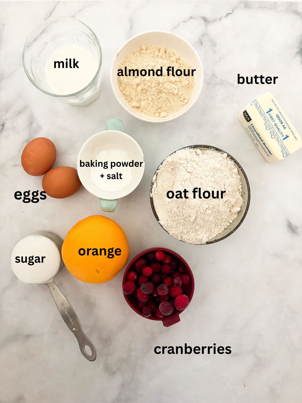 Tender and lightly sweet, these gluten-free cranberry scones are infused with orange zest and juicy cranberries. Ingredients for gluten free cranberry scones are text-labeled.