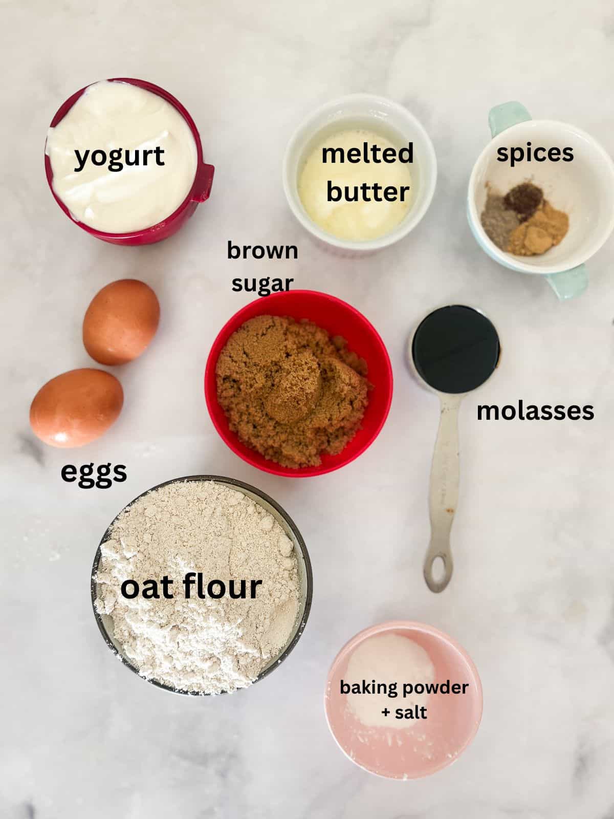 Warmly spiced gluten-free gingerbread muffins take everything you love about classic gingerbread and turn it into a handheld snack! Ingredients for gluten free gingerbread muffins are text labeled.