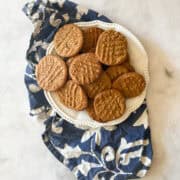A plate of flourless peanut butter cookies on a napkin.