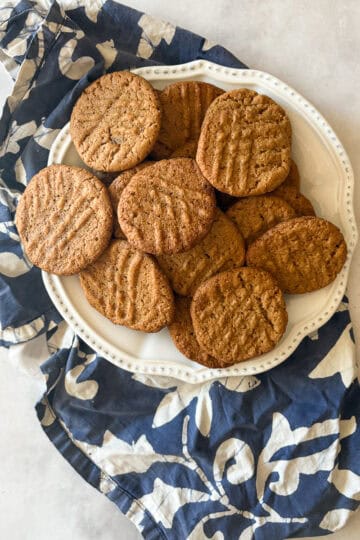 A plate of flourless peanut butter cookies on a napkin.