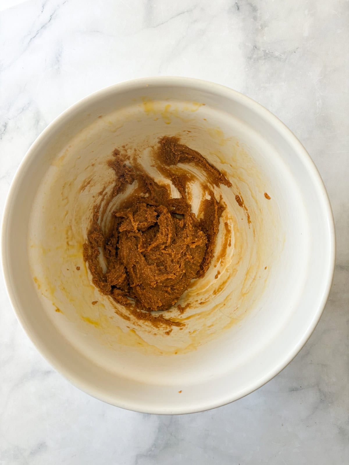 The easiest flourless peanut butter cookies are made with simple ingredients to create a deliciously flavorful cookie. The dough for flourless peanut butter cookies in a bowl.