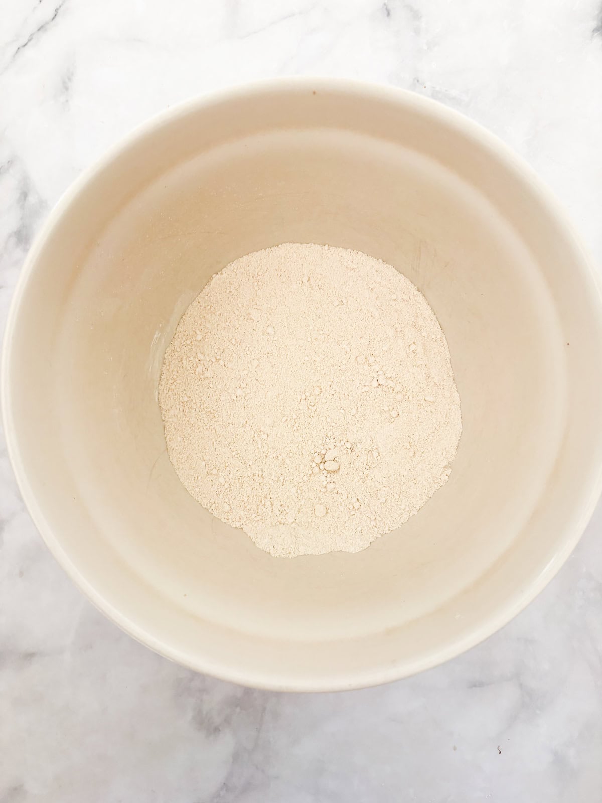 Tender and lightly sweet, these gluten-free cranberry scones are infused with orange zest and juicy cranberries. The flour mix for gluten free cranberry scones in a bowl.