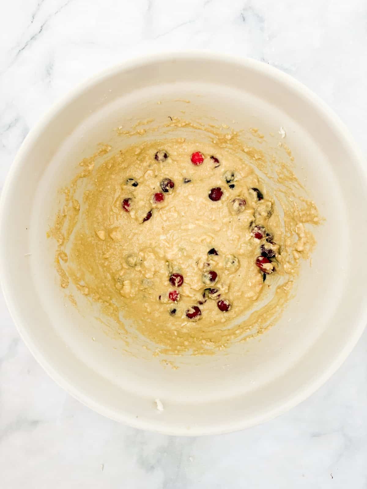 Tender and lightly sweet, these gluten-free cranberry scones are infused with orange zest and juicy cranberries. The dry and wet mix are combined, plus cranberries, for gluten free cranberry scones.