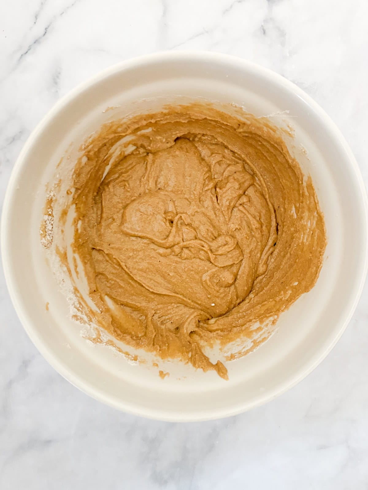 Gluten free snickerdoodles dough in a bowl.
